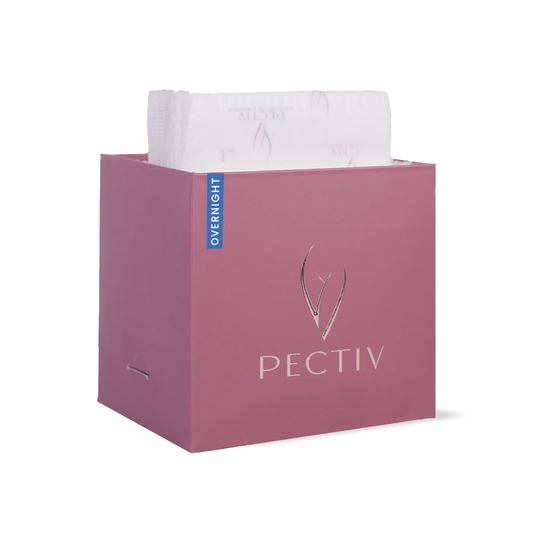 Opened packaging of Pectiv The Overnight pads showcasing discreetly sealed extra-long night sanitary napkins.